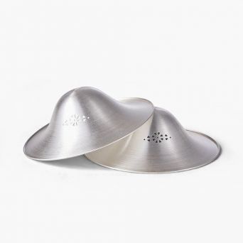 Two stacked Momcozy 999 pure silver nursing cups showing the conical shape, ergonomic fit, and small breathability perforations for natural nipple healing.