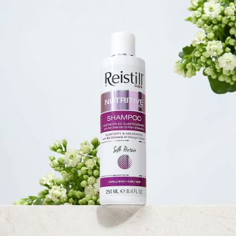Reistill Nutritive Deep Shampoo for curly hair 250 ml bottle with white flowers highlighting nourishing formula
