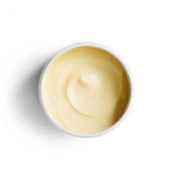 Creamy texture of Reistill Repair Essential Hair Mask for damaged hair – open jar top view